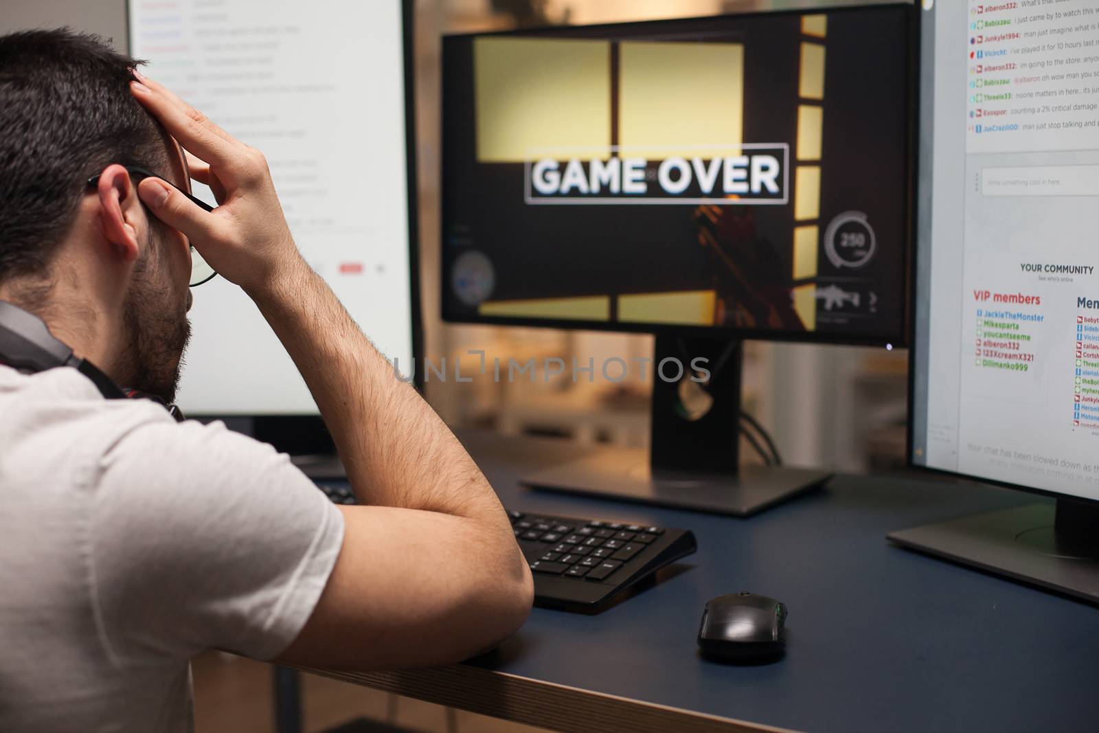 Angry man with eyeglasses after hir loss on online shooter game by DCStudio