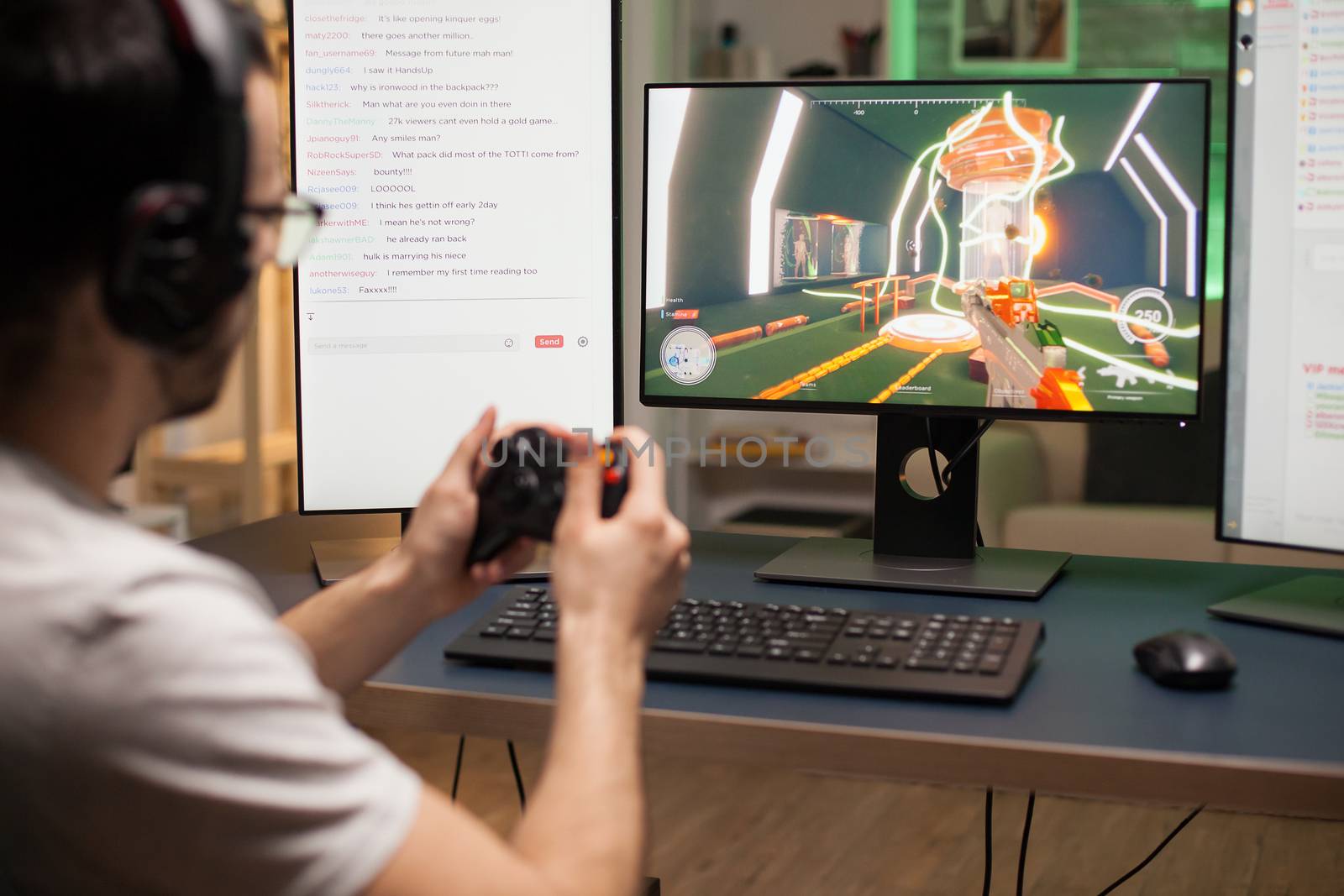 Concentrated young man using joystick while playing online shooter games.