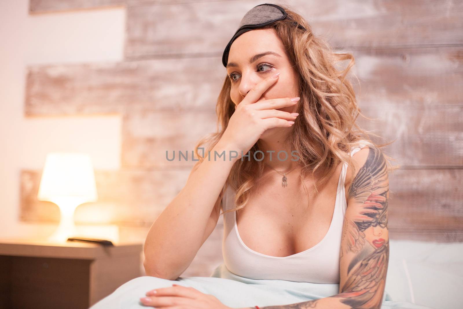 Attractive beautiful woman can't sleep because of a nightmare.