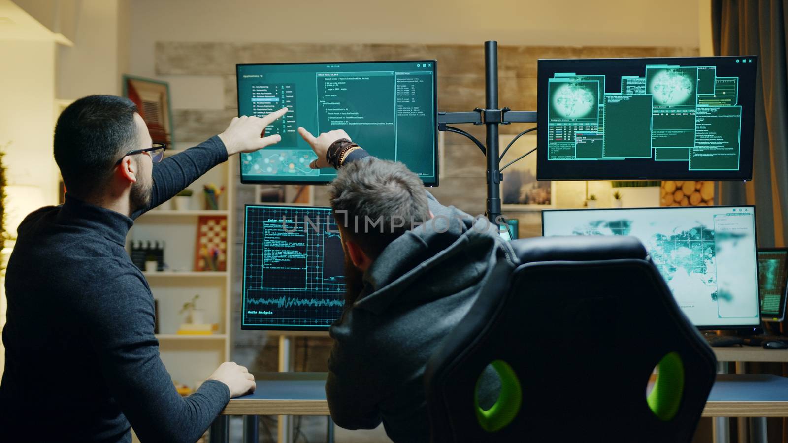 Team of dangerous male hacker using a powerful computer to spy the government. Security breach.