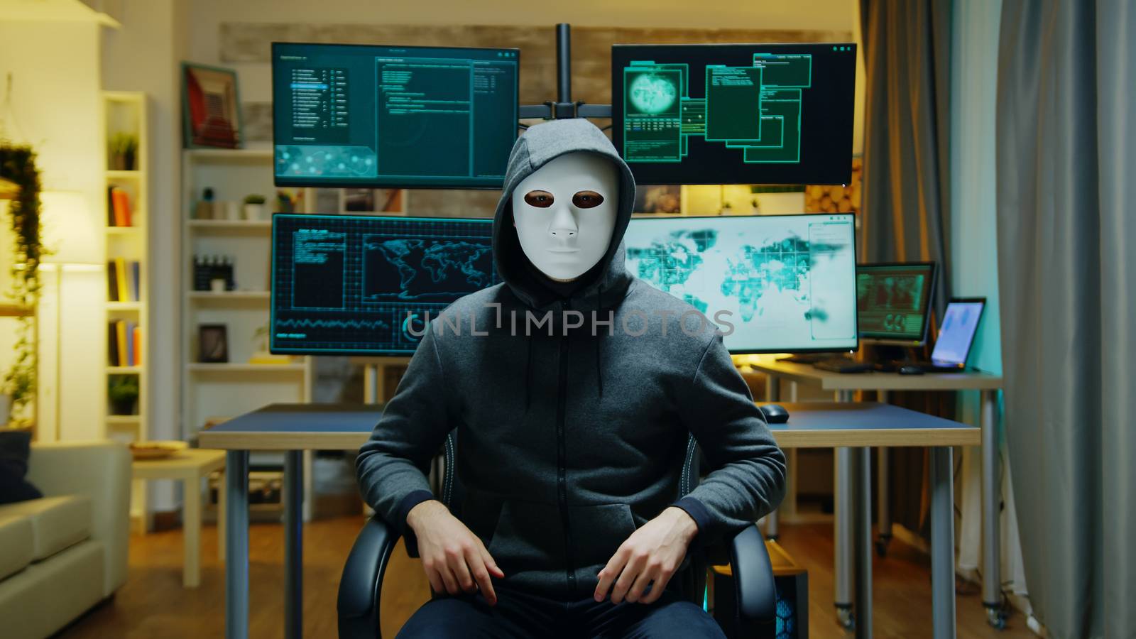 Cyber criminal wearing a white mask using augmented reality by DCStudio