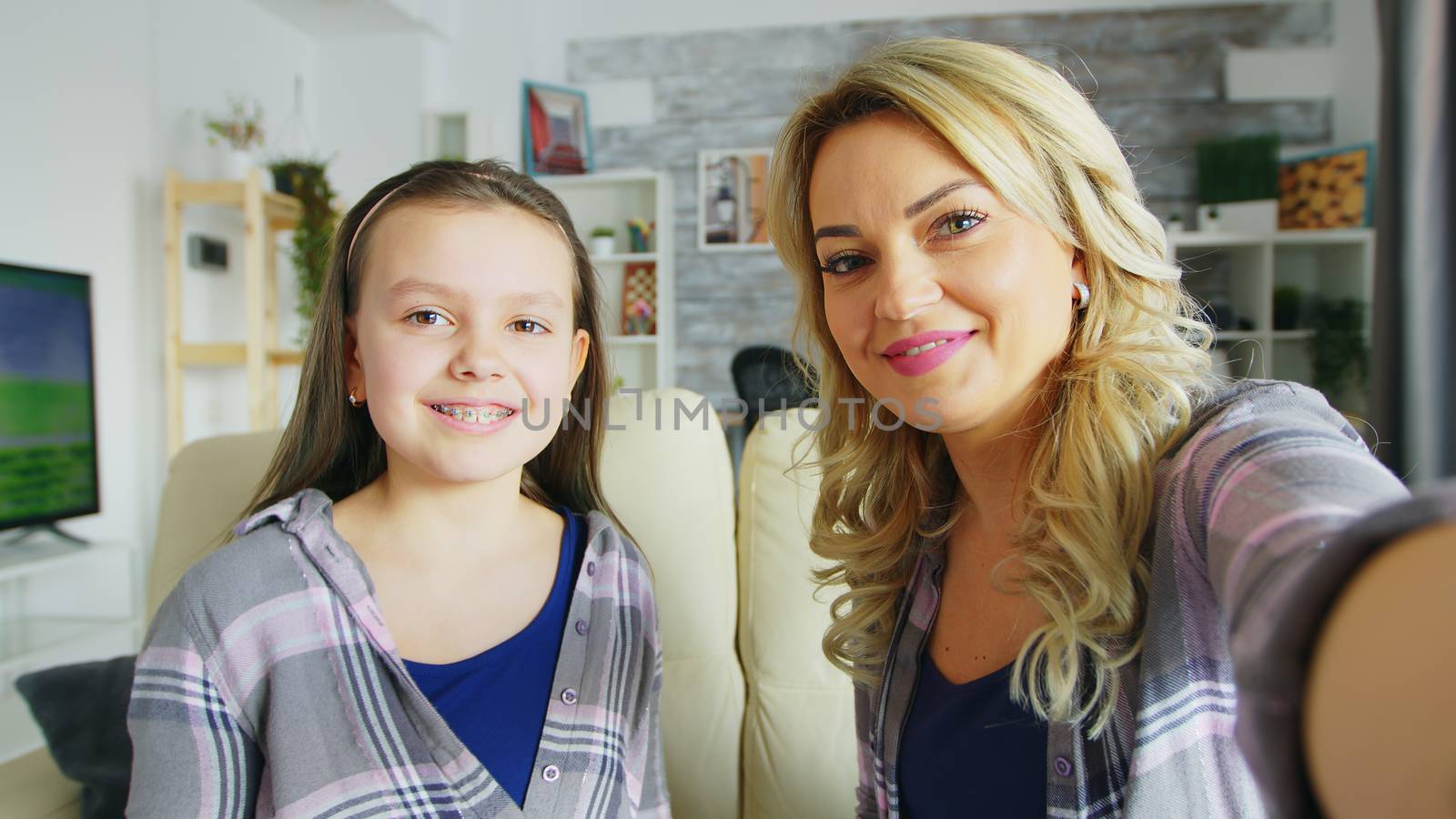 Pov of happy daughter with braces and her mother by DCStudio