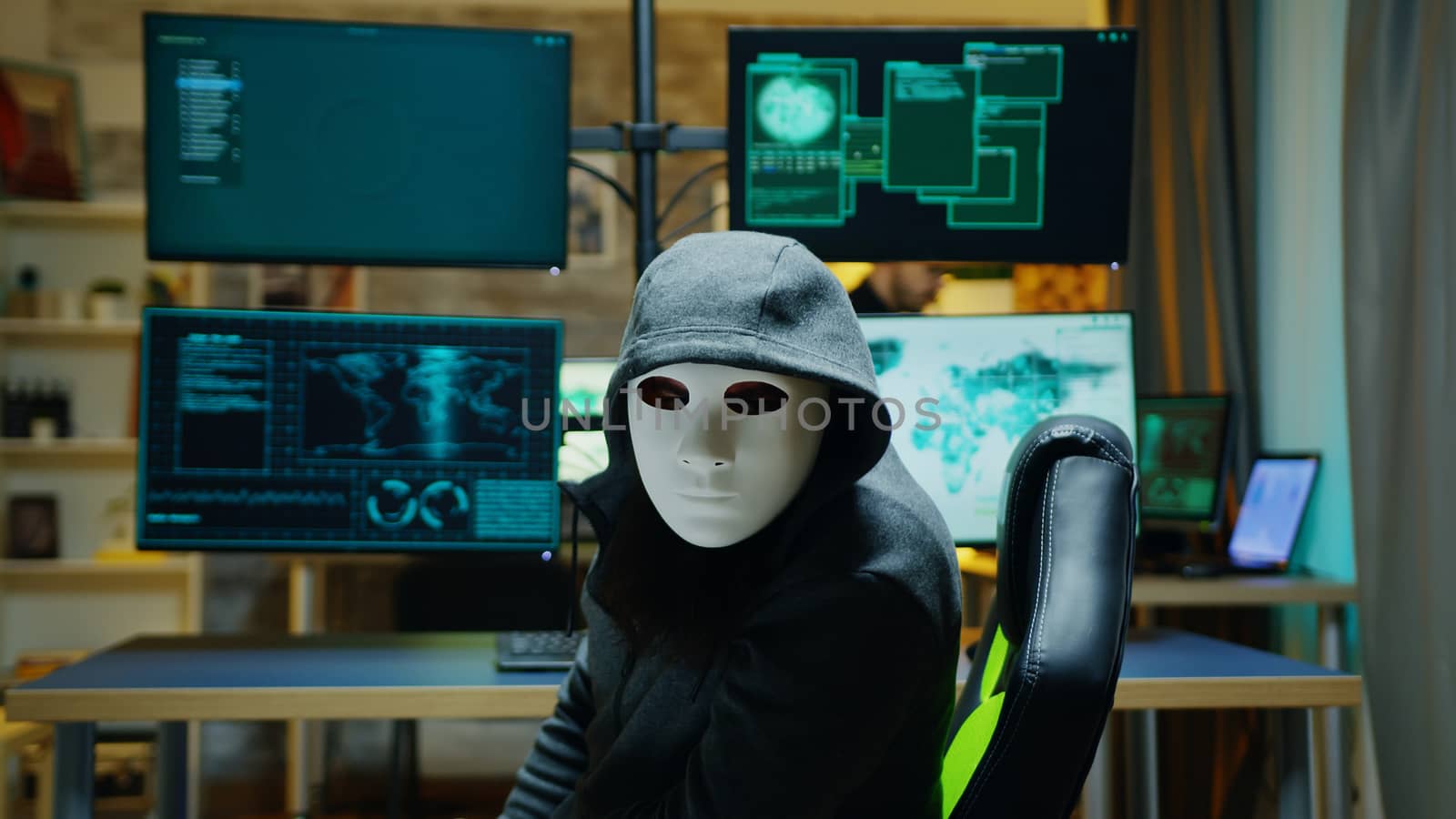 Masked hacker wearing a hoodie to hide his identity by DCStudio