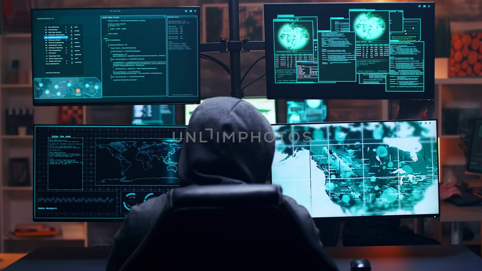 Back view of male hacker wearing a hoodie infecting government server with a dangerous virus.