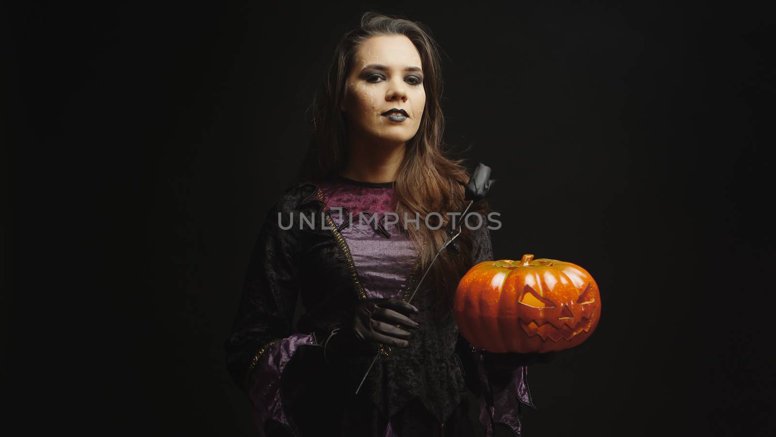 Young woman dressed up like a witch by DCStudio