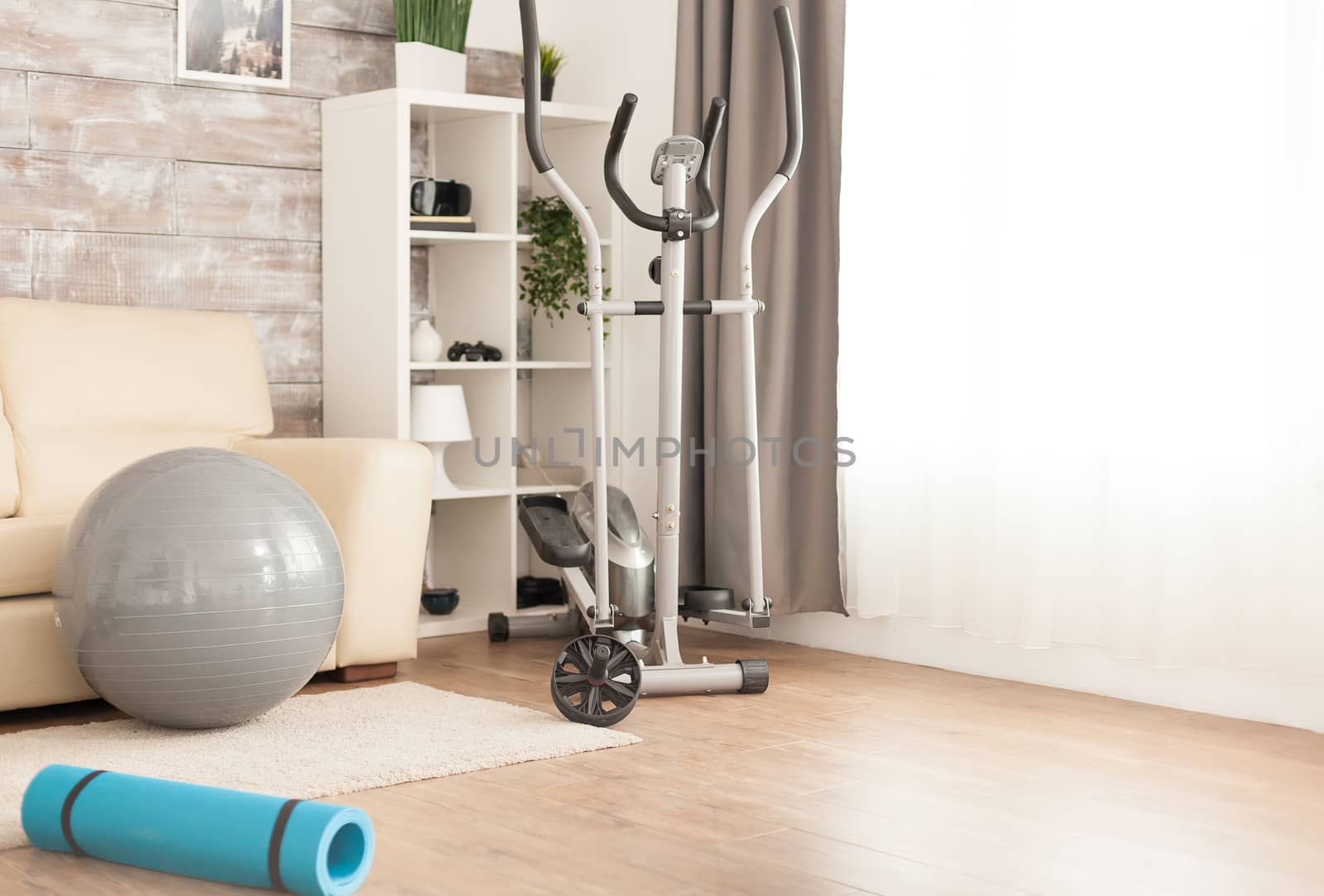 Fitness accessories for body training at home in empty room.