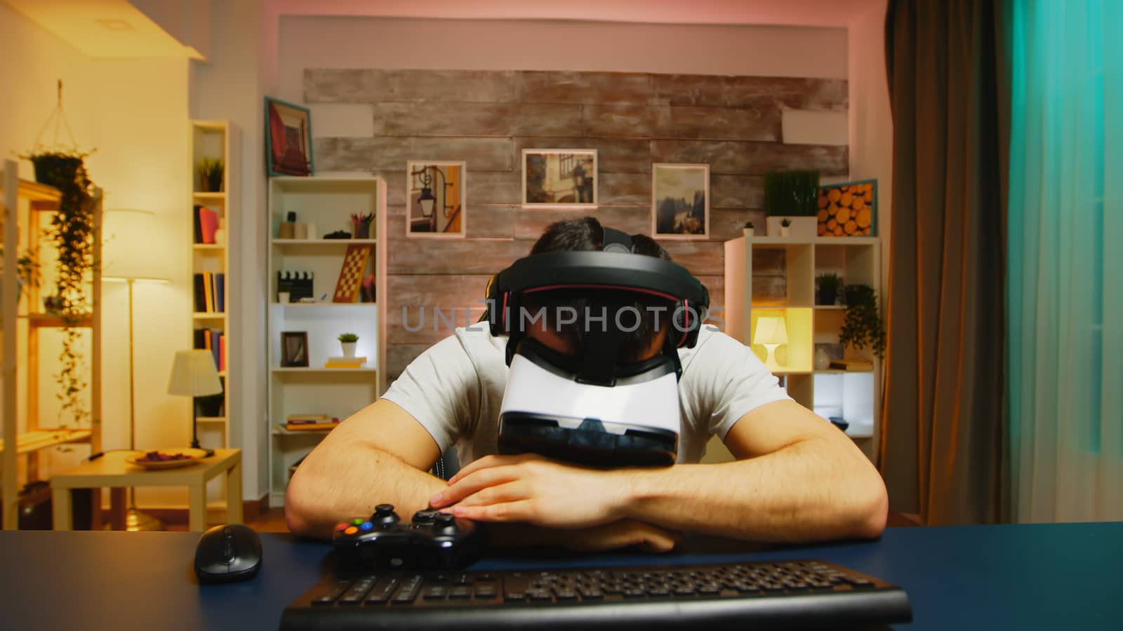 Pov of angry young man wearing virtual reality headset by DCStudio
