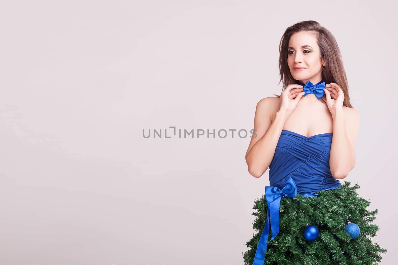 Smiling woman in conceptual christmas dress by DCStudio