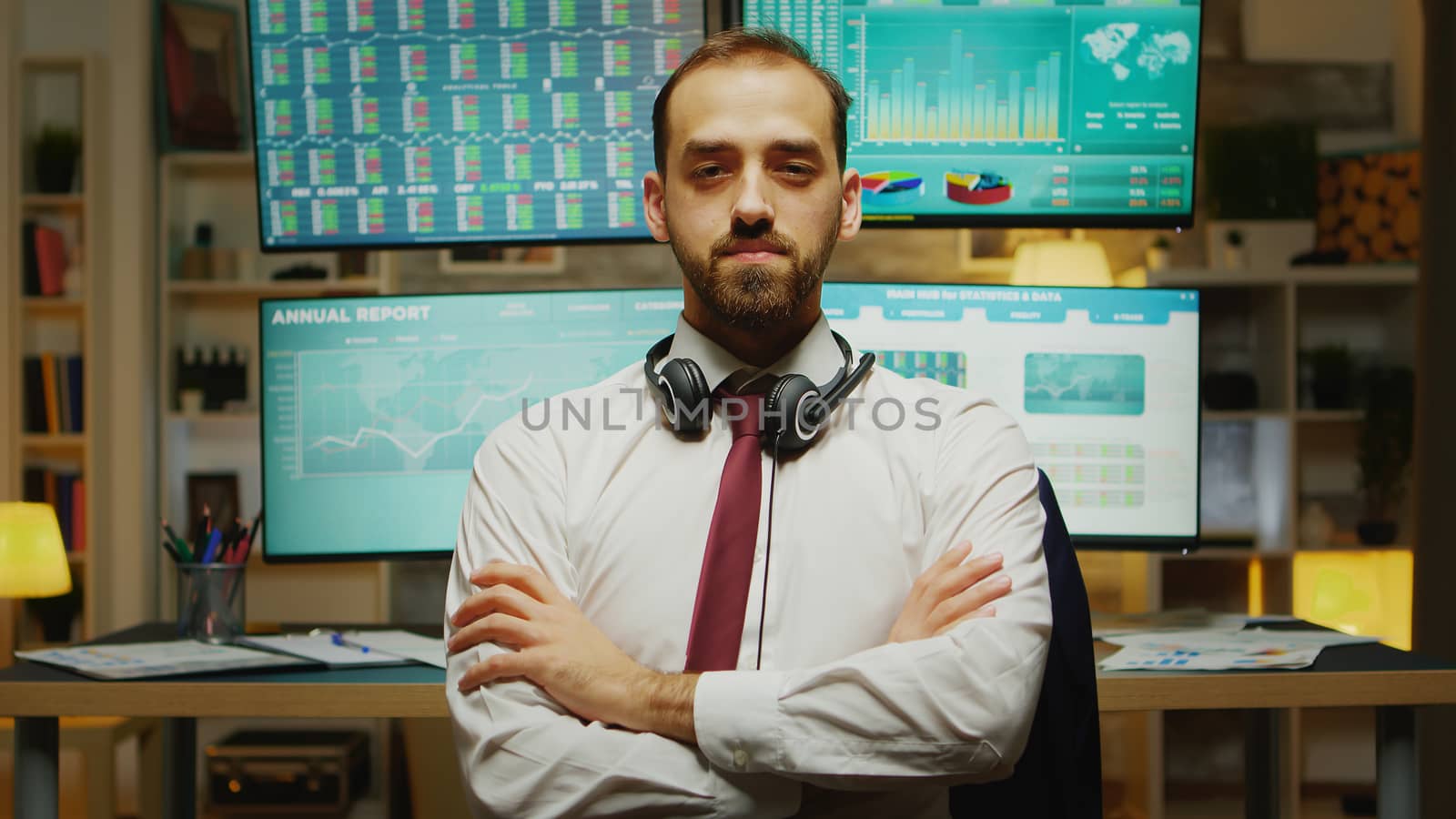 Bearded stock market trader looking at the camera by DCStudio