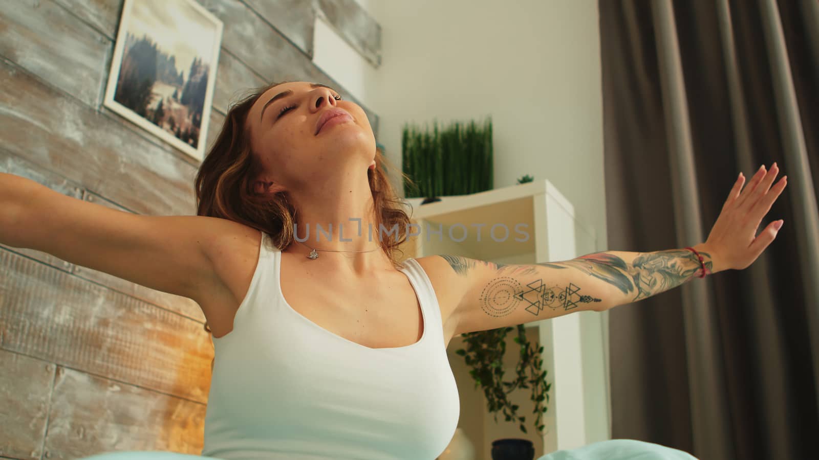 Beautiful young woman waking up after a good dream by DCStudio