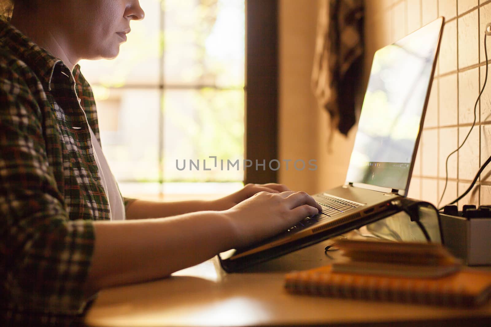 Businesswoman working on laptop from home during covid-19.