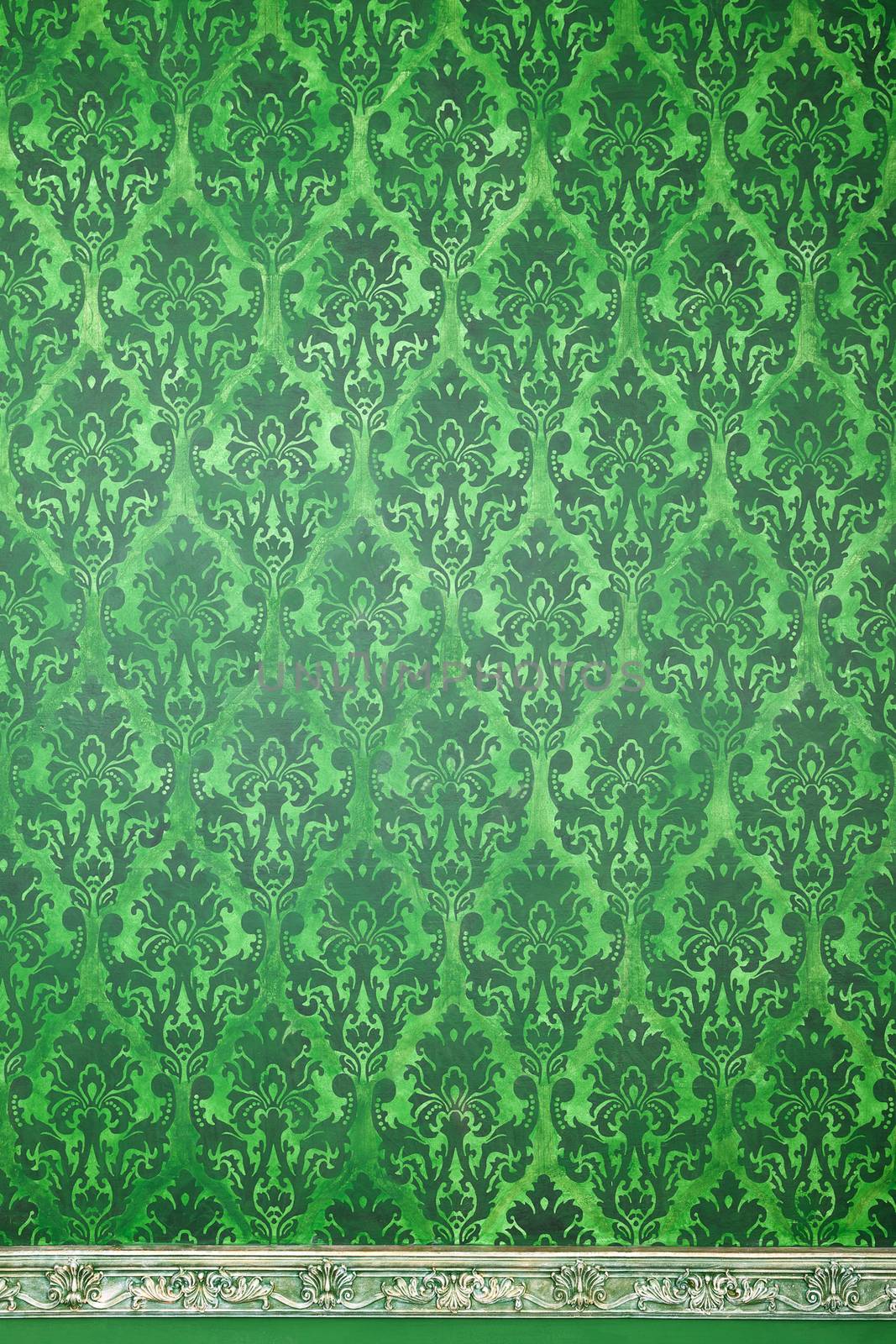 Green interior of vitnage room with pattern elements by DCStudio