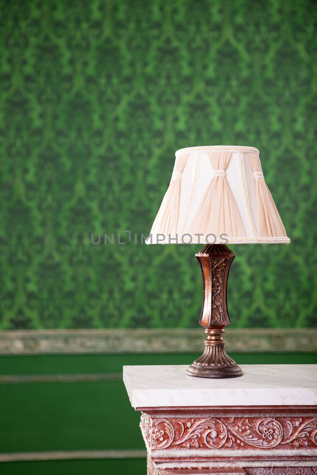 Vintage lamp on chimney on green retro pattern background by DCStudio