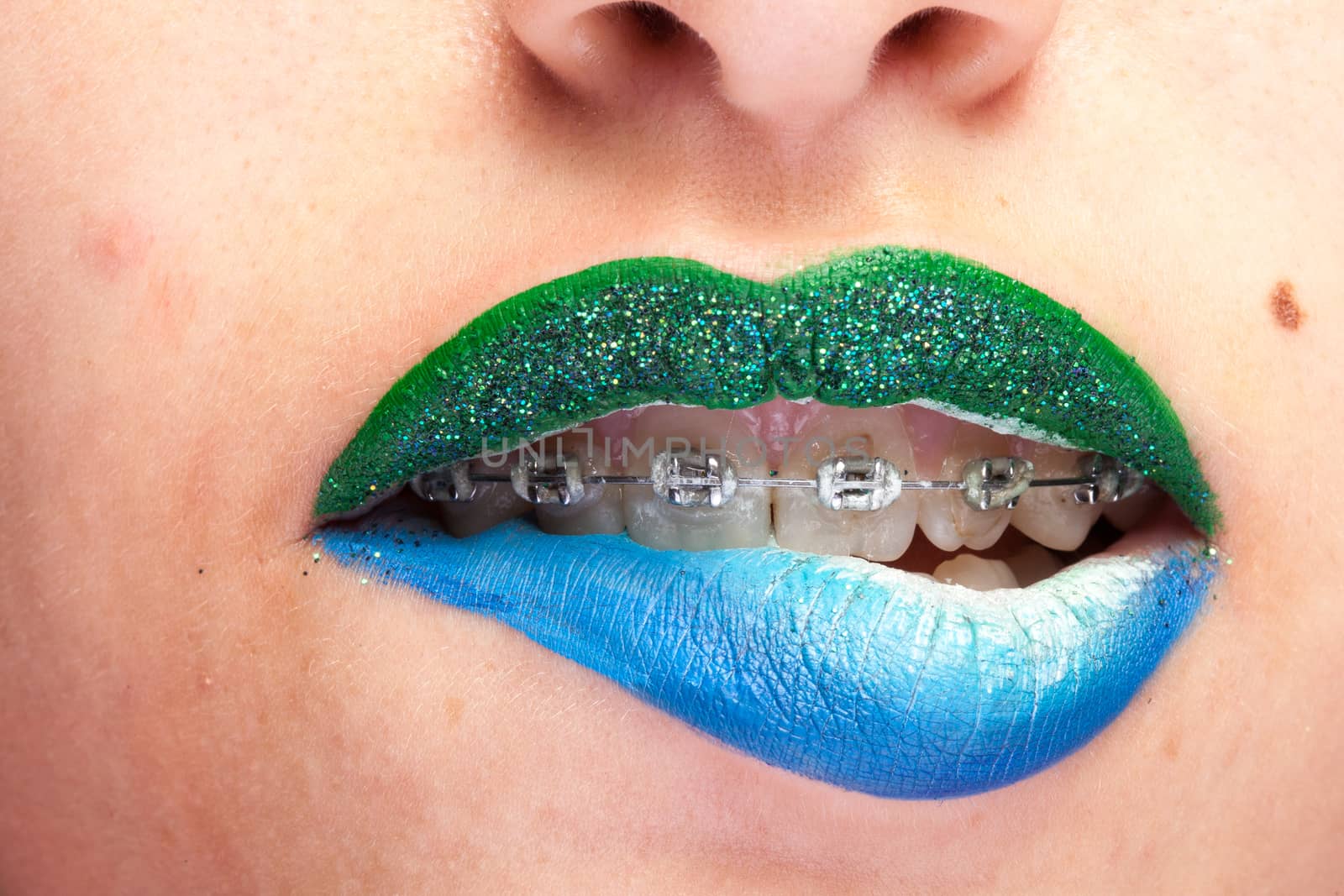 Beauty image of lips with artistic make up in studio photo