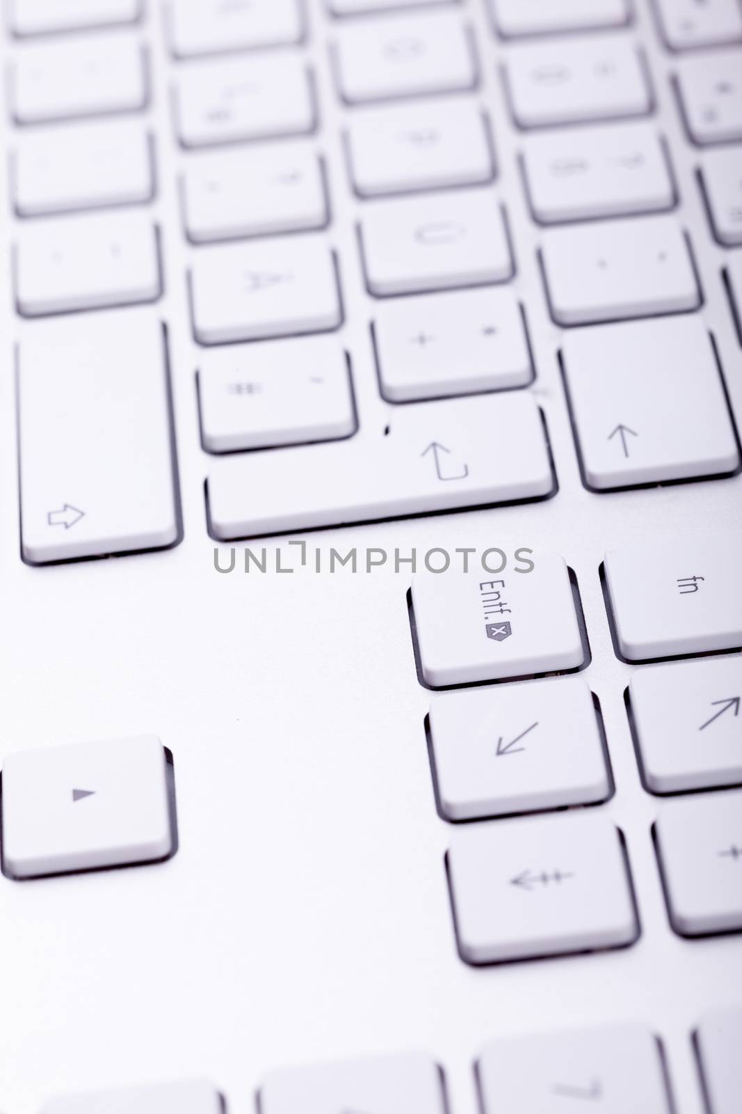 White aluminum keyboard in close up by DCStudio