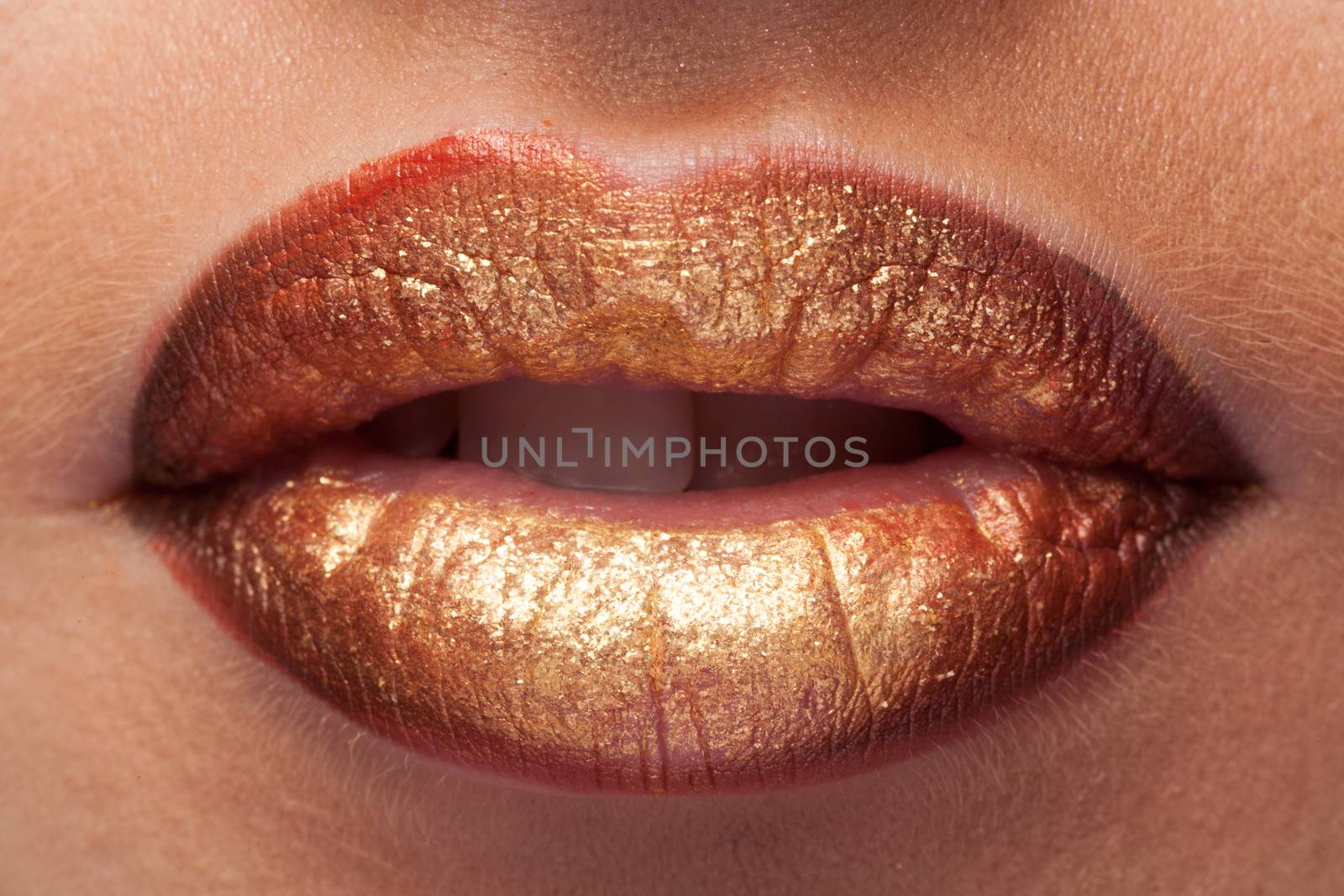 Close up shooting of mouth with lipstick. Studio shooting. Make up perfection. Perfect skin