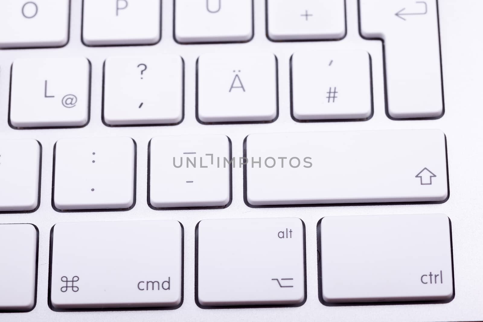 White aluminum keyboard in close up. Technology and communication