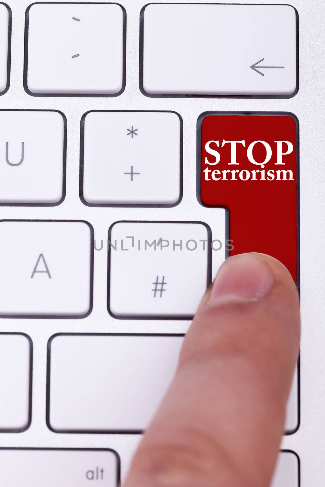 Finger pressing on stop terrorism button on keyboard. Stop the crimes against civil people