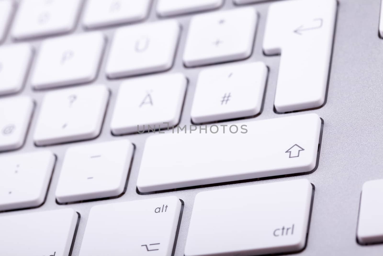 White aluminum keyboard in close up. Technology and communication