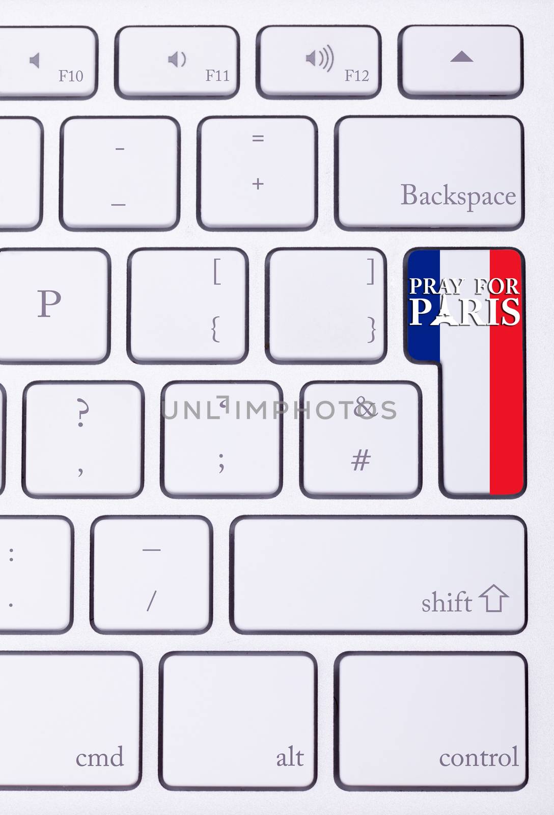 Pray for Paris sign on france flag in keyboard. International suport for Paris victims in terrorist atack