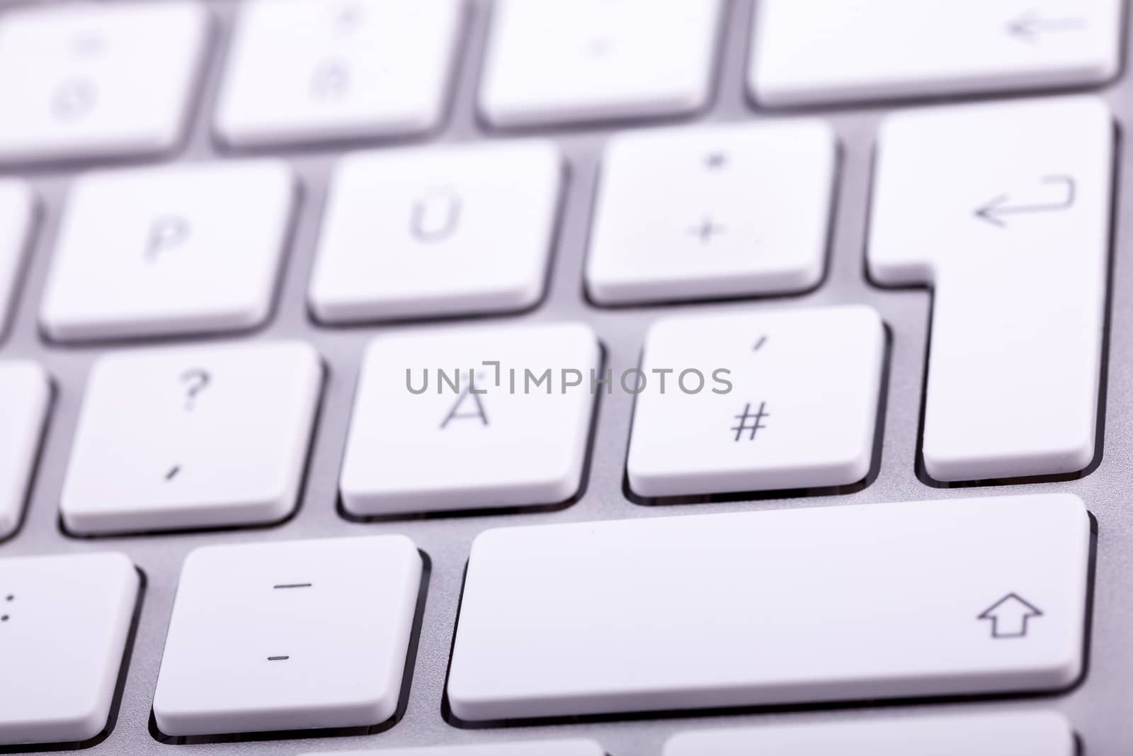 White aluminum keyboard in close up. Technology and communication