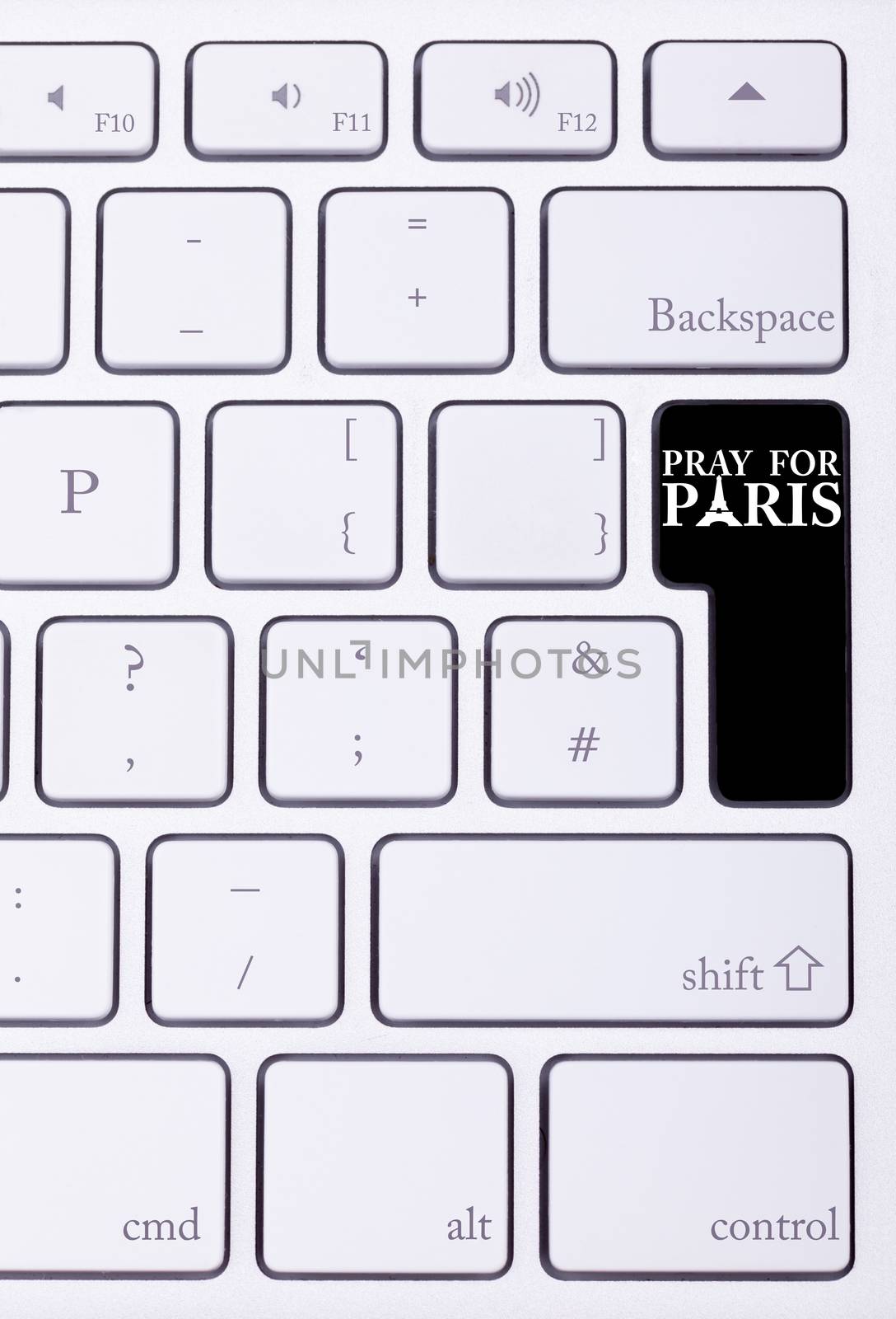 Black button on keyboard with pray for paris sign on it. International suport for Paris victims in terrorist atack