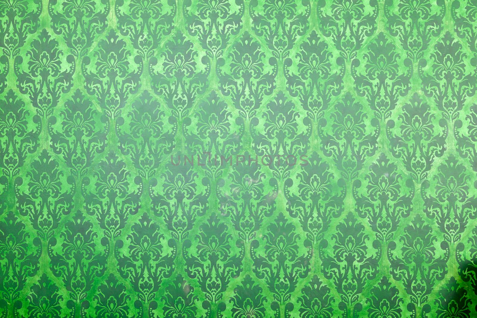 Green vintage pattern on old wall. Rich vintage retro pattern interior