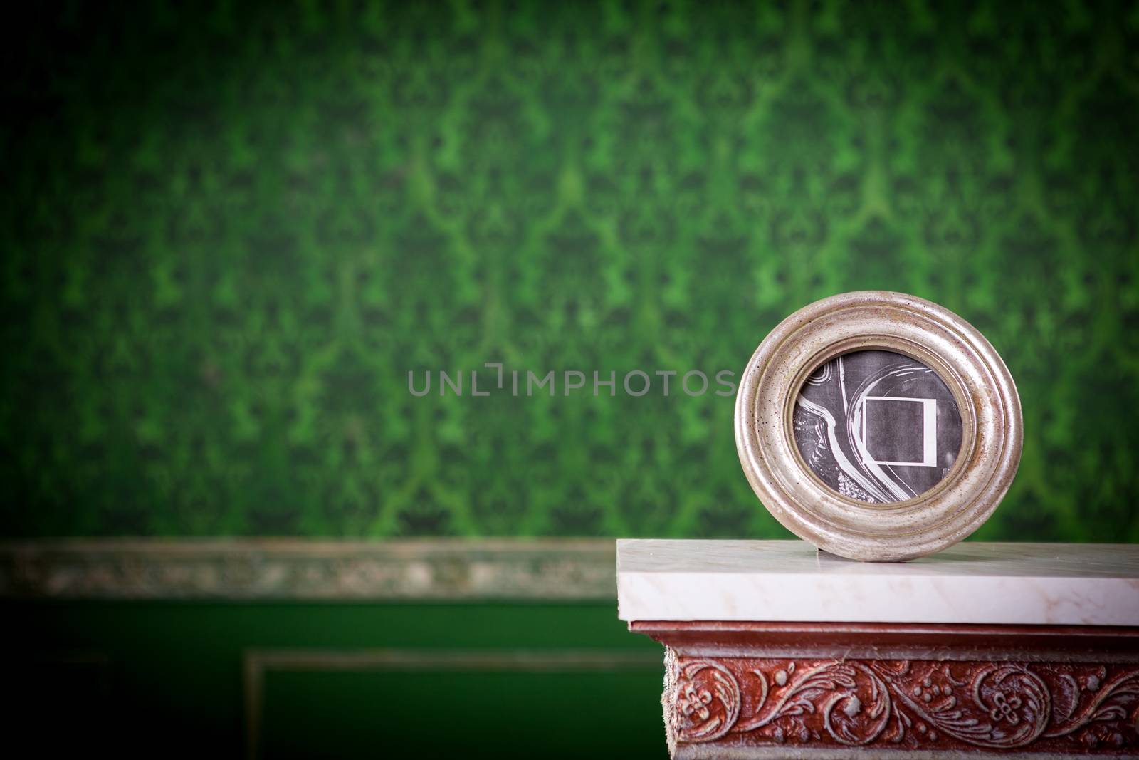 Vintage photo frame with copyspace on green vintage background