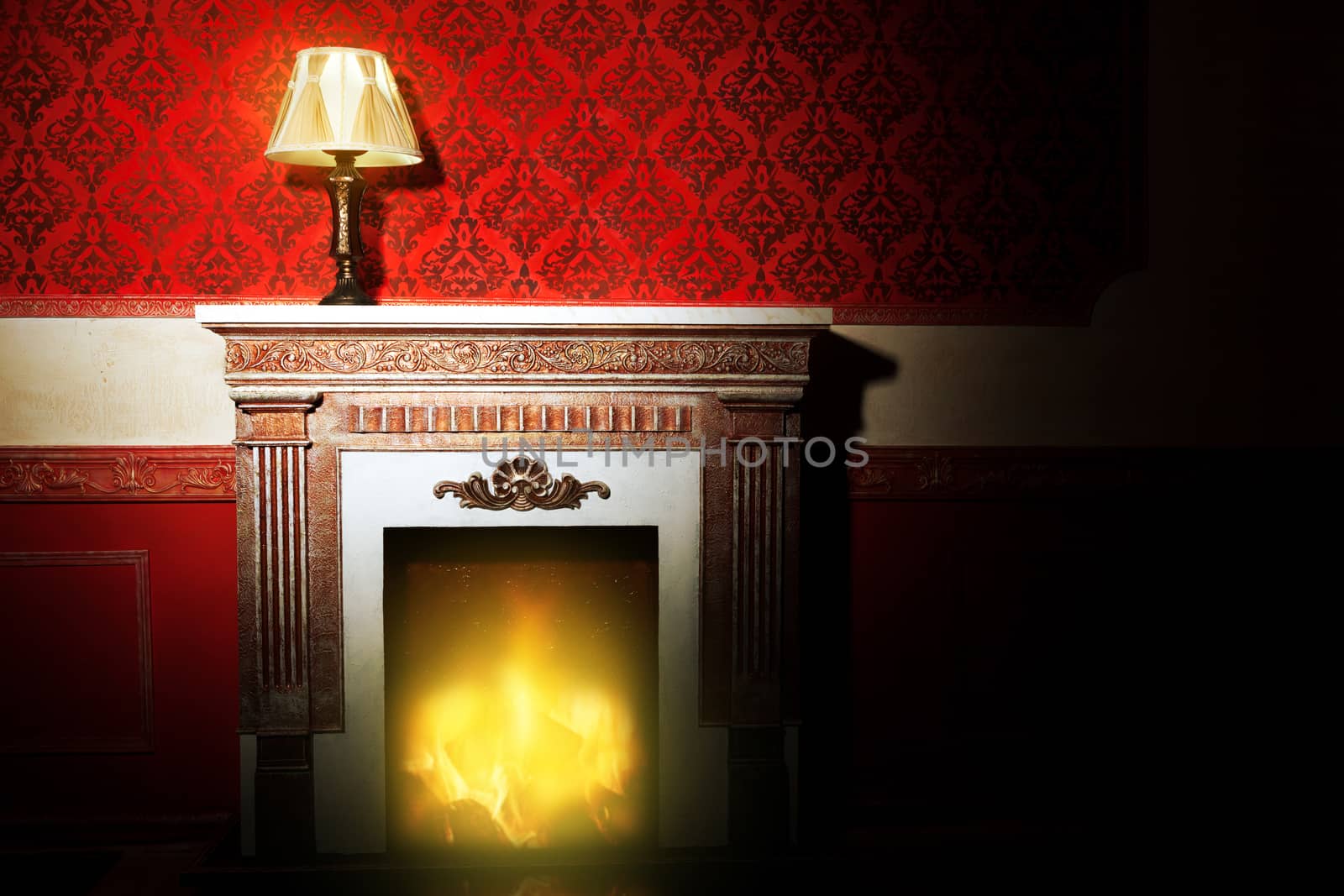 Rich interior with antique lamp and fireplace in red vintage room studio shooting