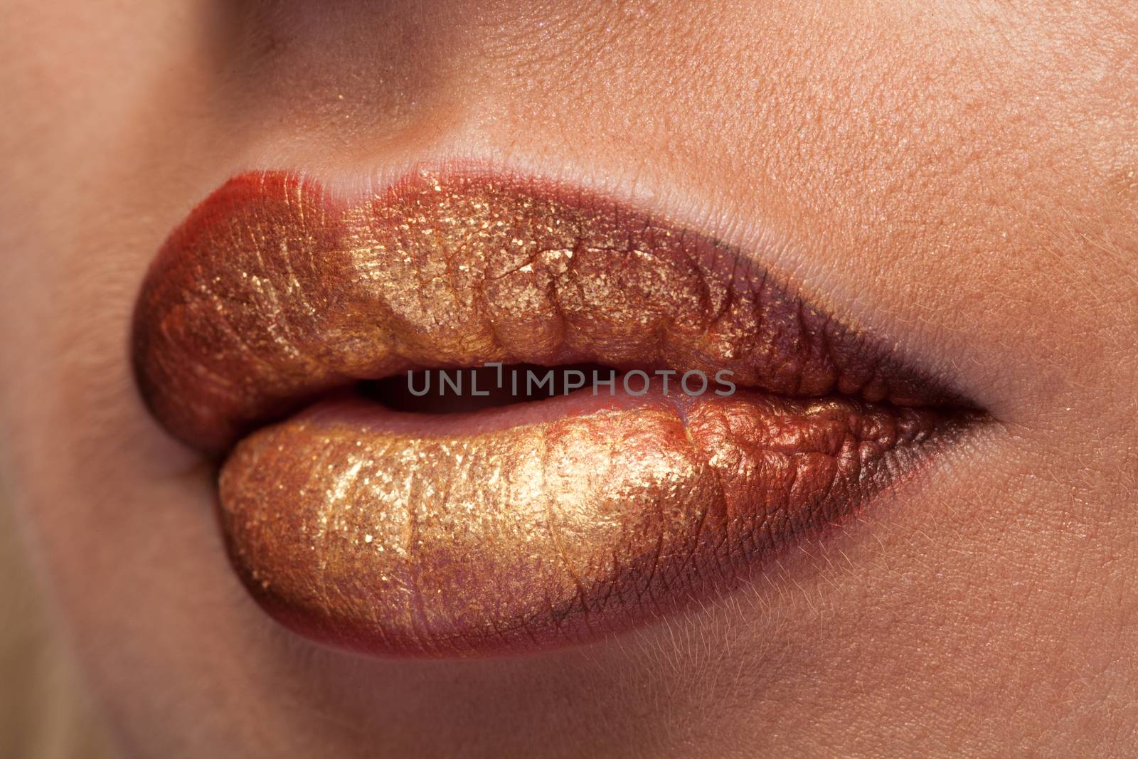 Close up of lips with lipstick on them in studio photo