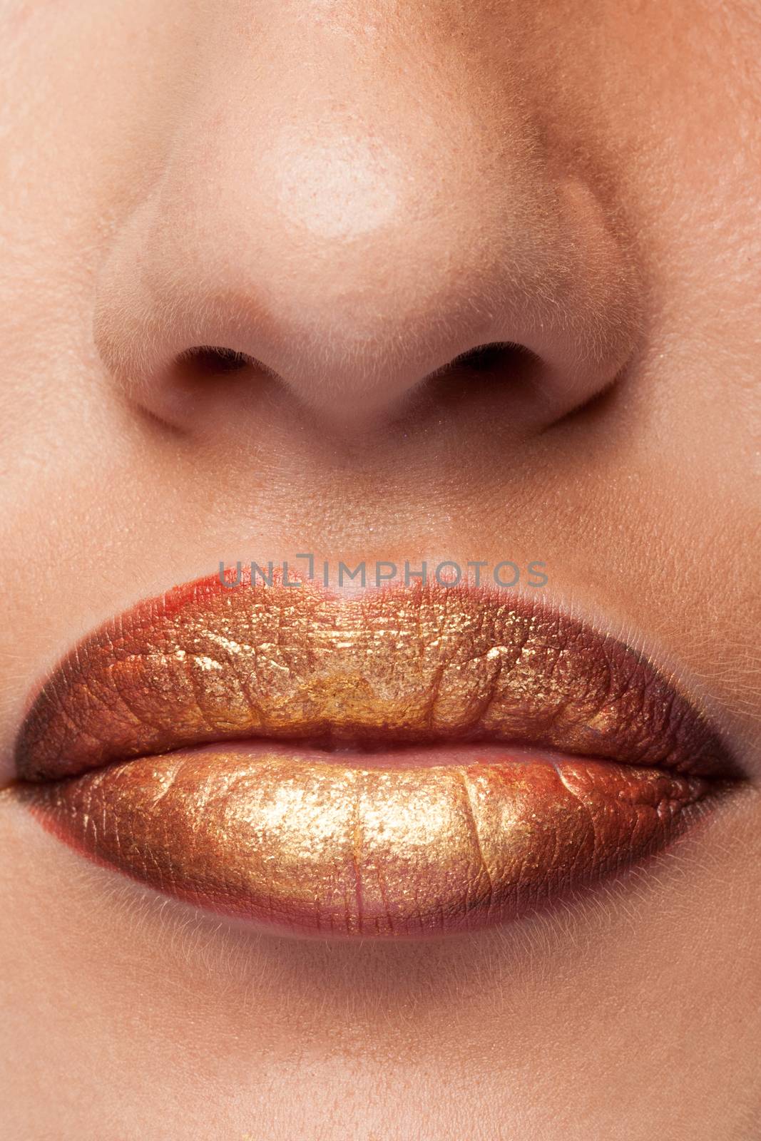 Close up of lips with lipstick on them in studio photo