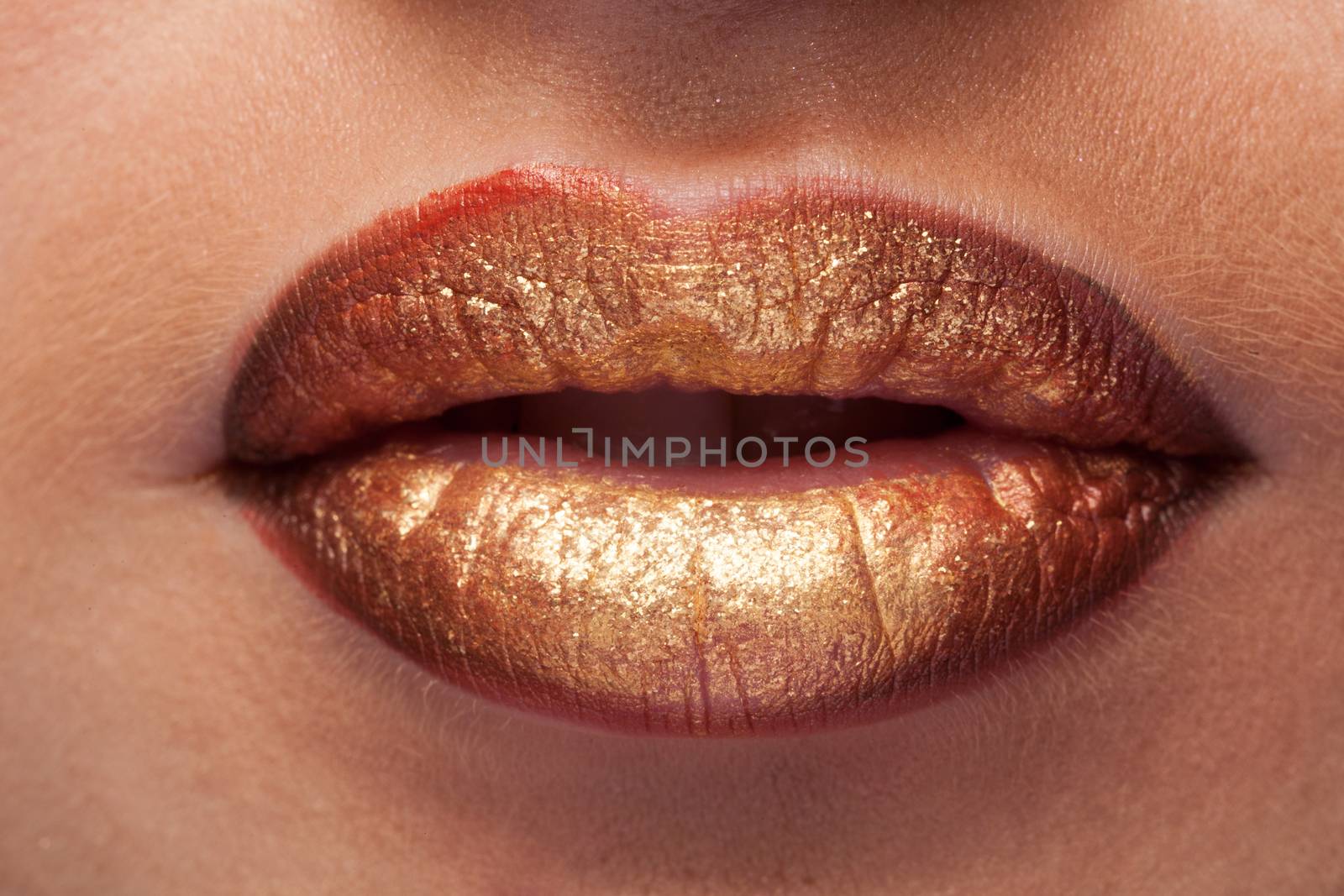 Close up shooting of mouth with lipstick. Studio shooting. Make up perfection. Perfect skin