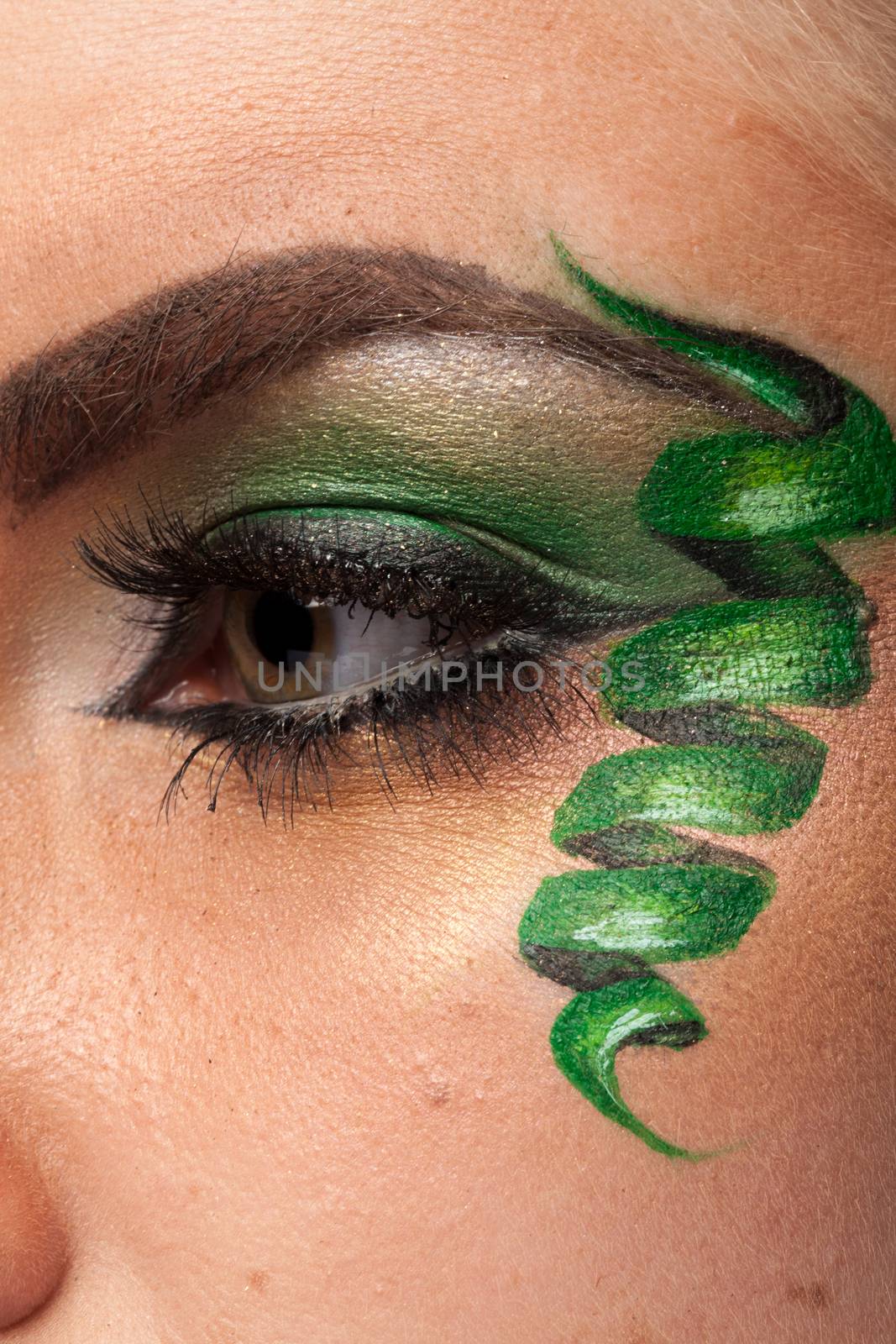 Close up of attractive eye with artistic make up by DCStudio