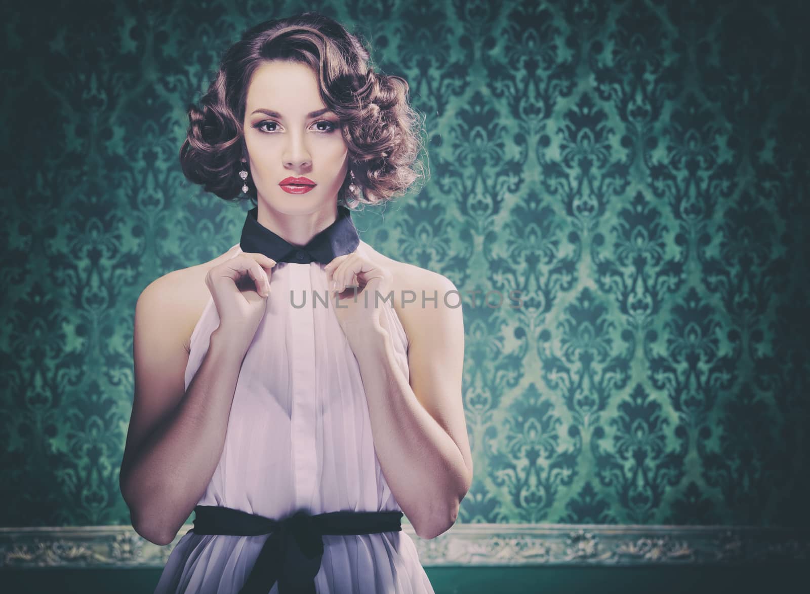 Gorgeous woman on vintage type wall with retro look. Vintage image and retro cameras type toning
