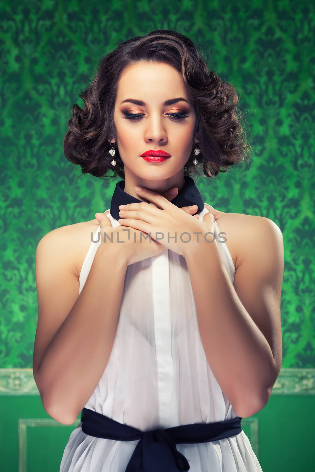 Retro style woman in vintage green room. Toned image. Professional make up and hairstyle