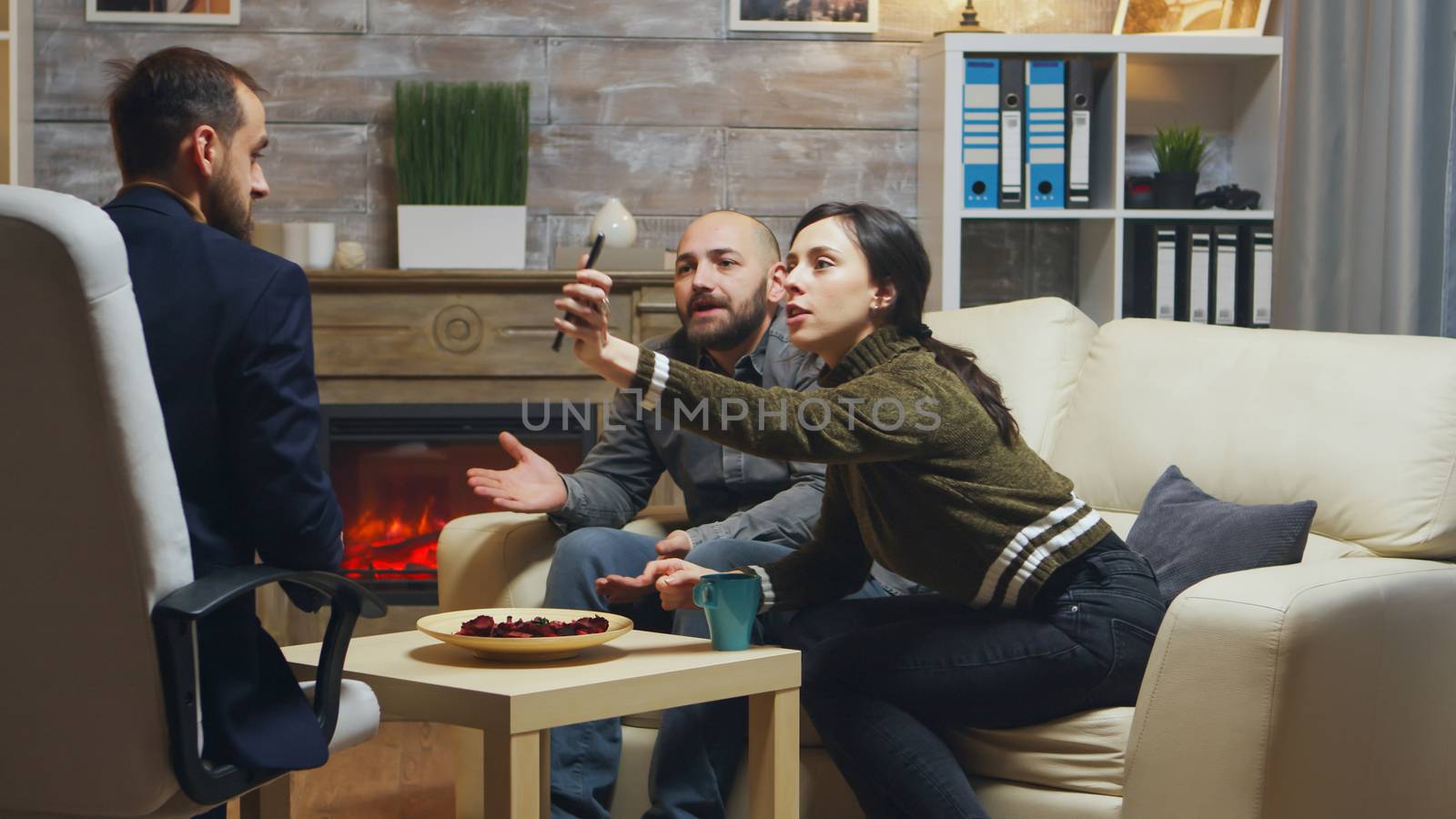 Husband and wife having a bad argument at couple therapy by DCStudio