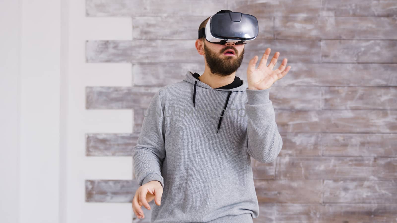 Caucasian home designer using virtual reality goggles by DCStudio