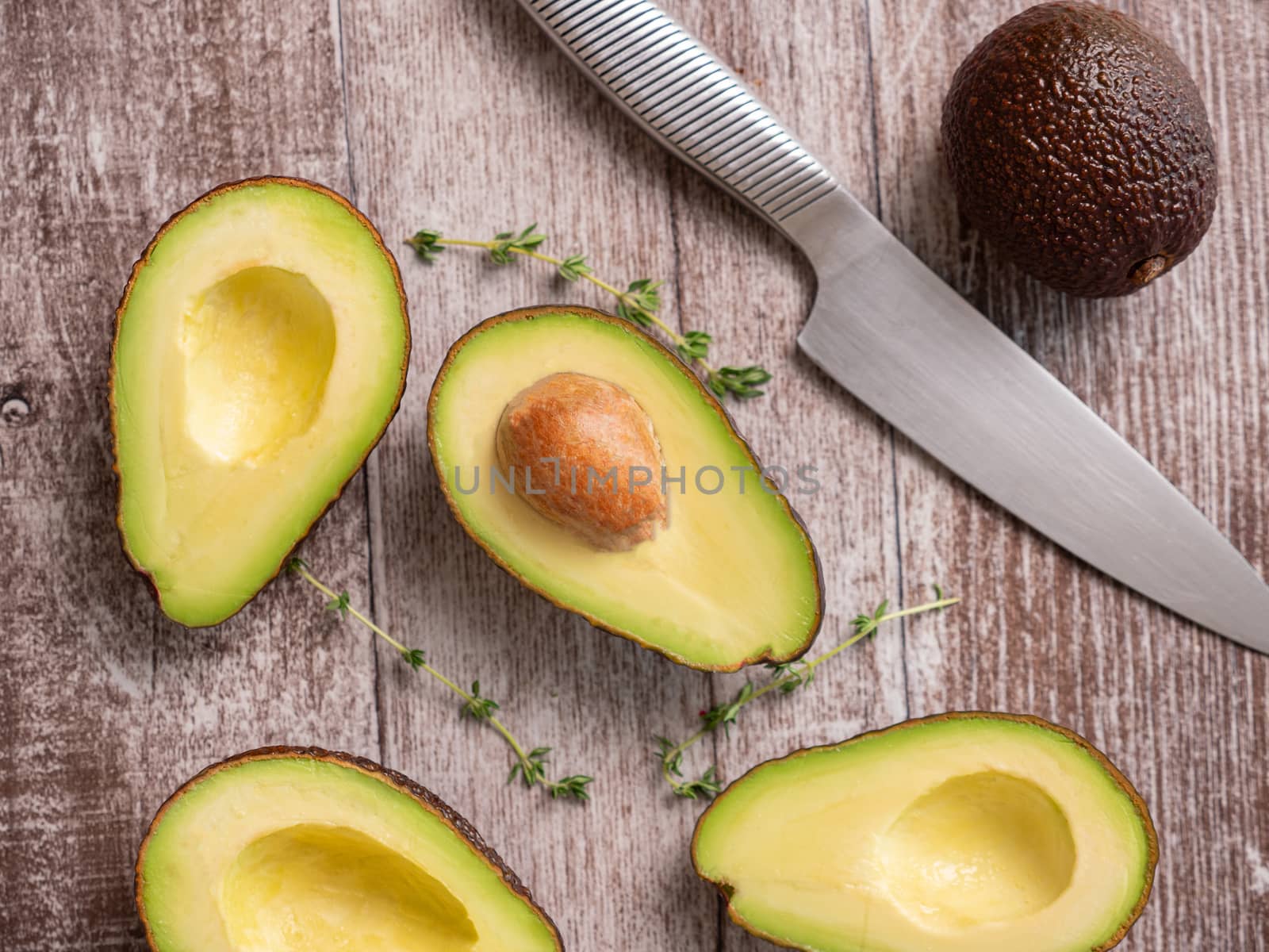 Top view of fresh cutted avocado on wooden board