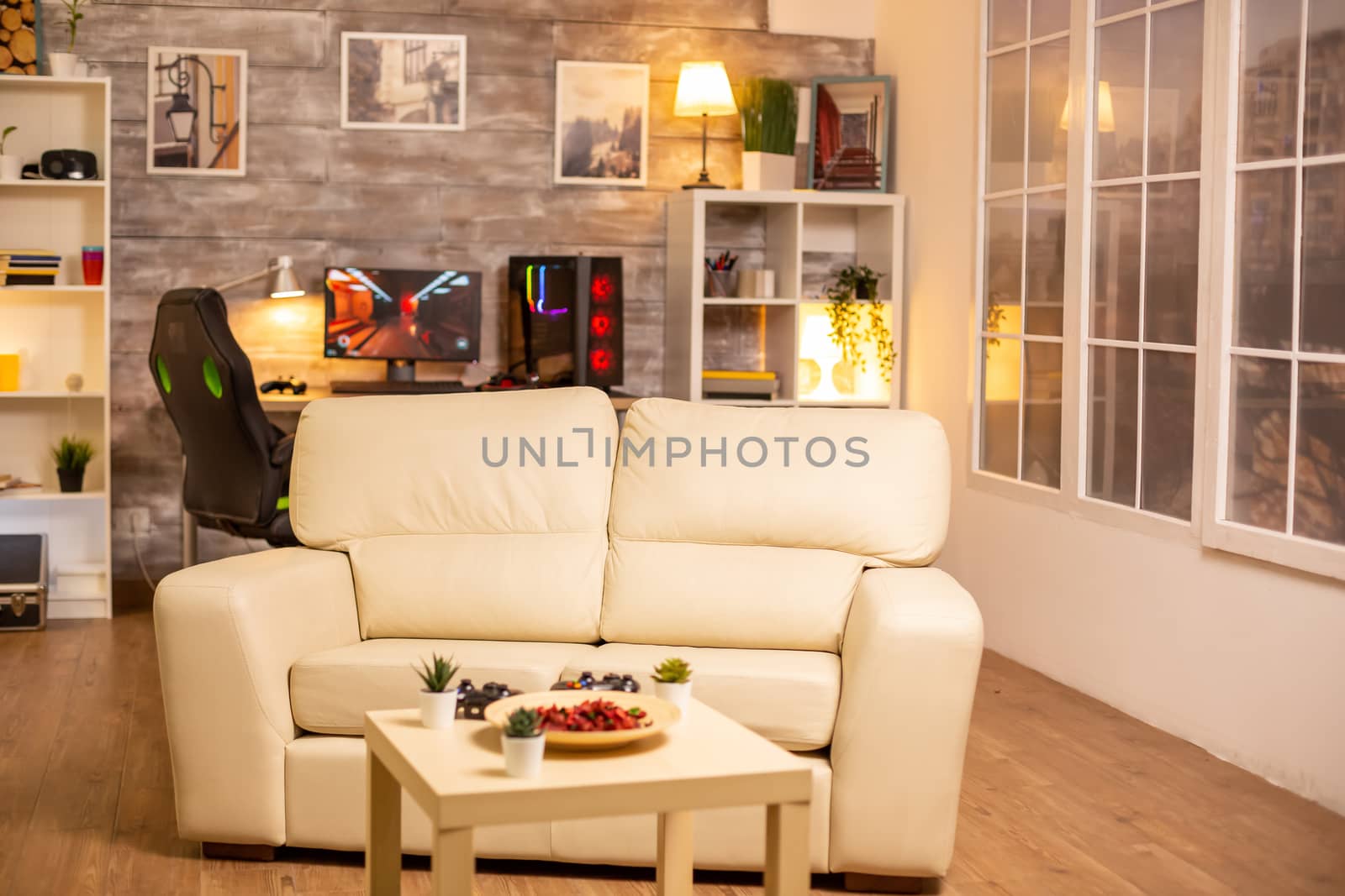 Empty living room interior with a PC in the background.