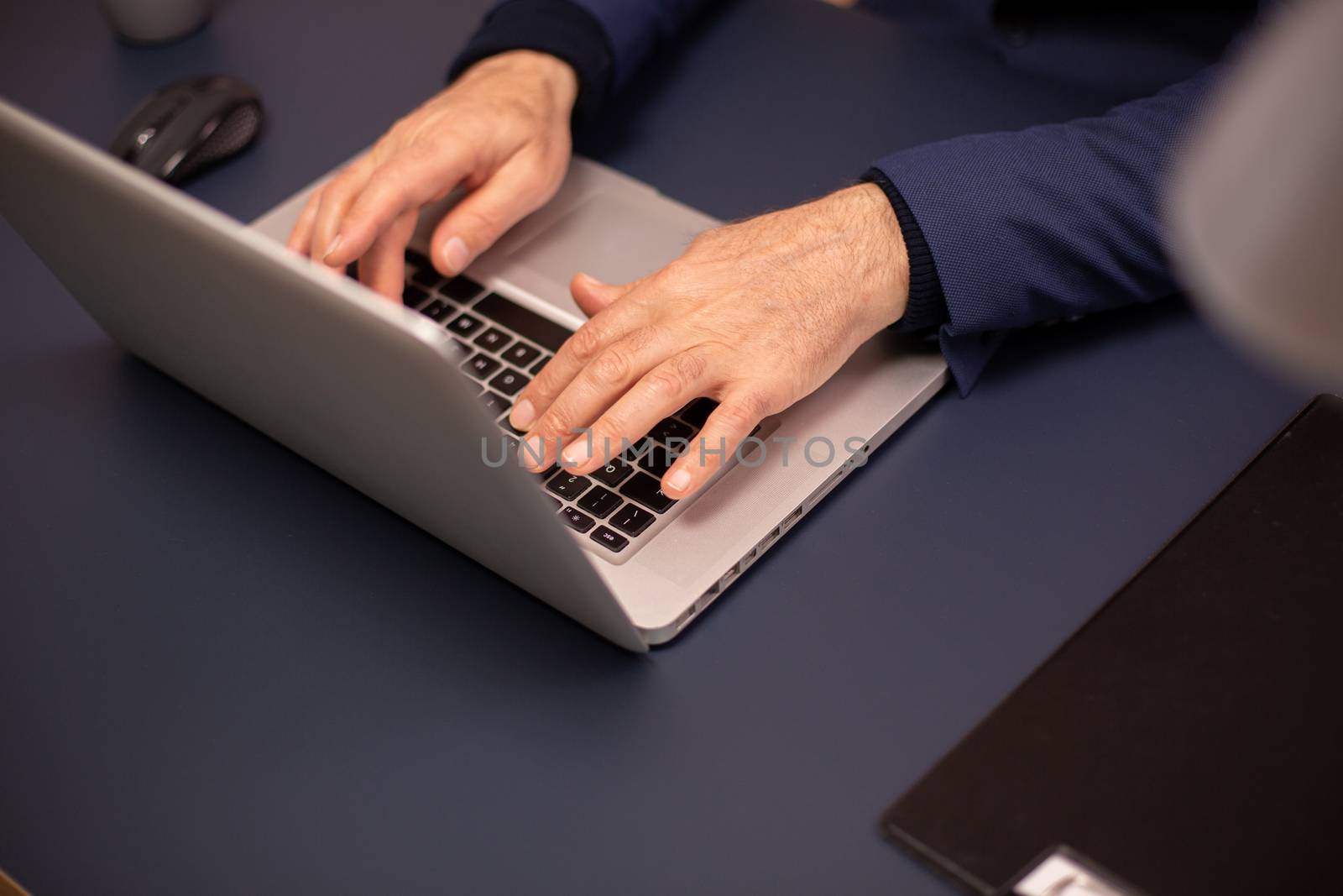 Close up shot of old people hands on new laptop.