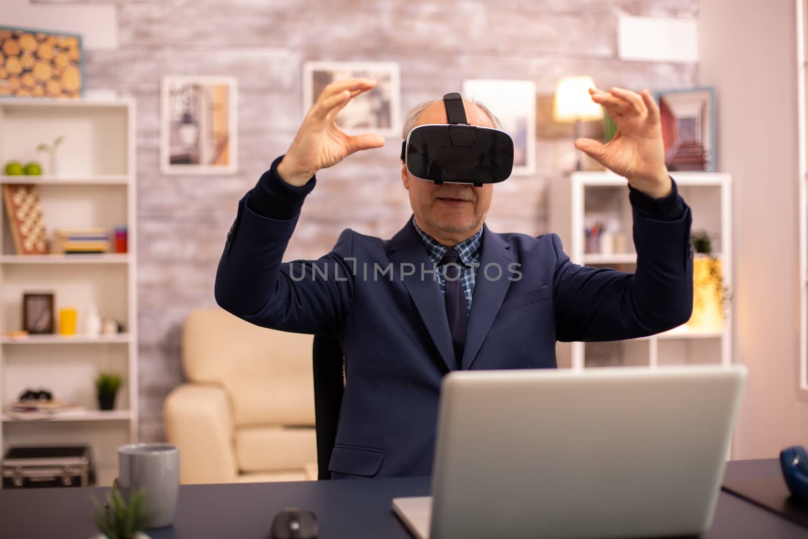 Elderly man experiencing new virtual reality technology for the first time in his home