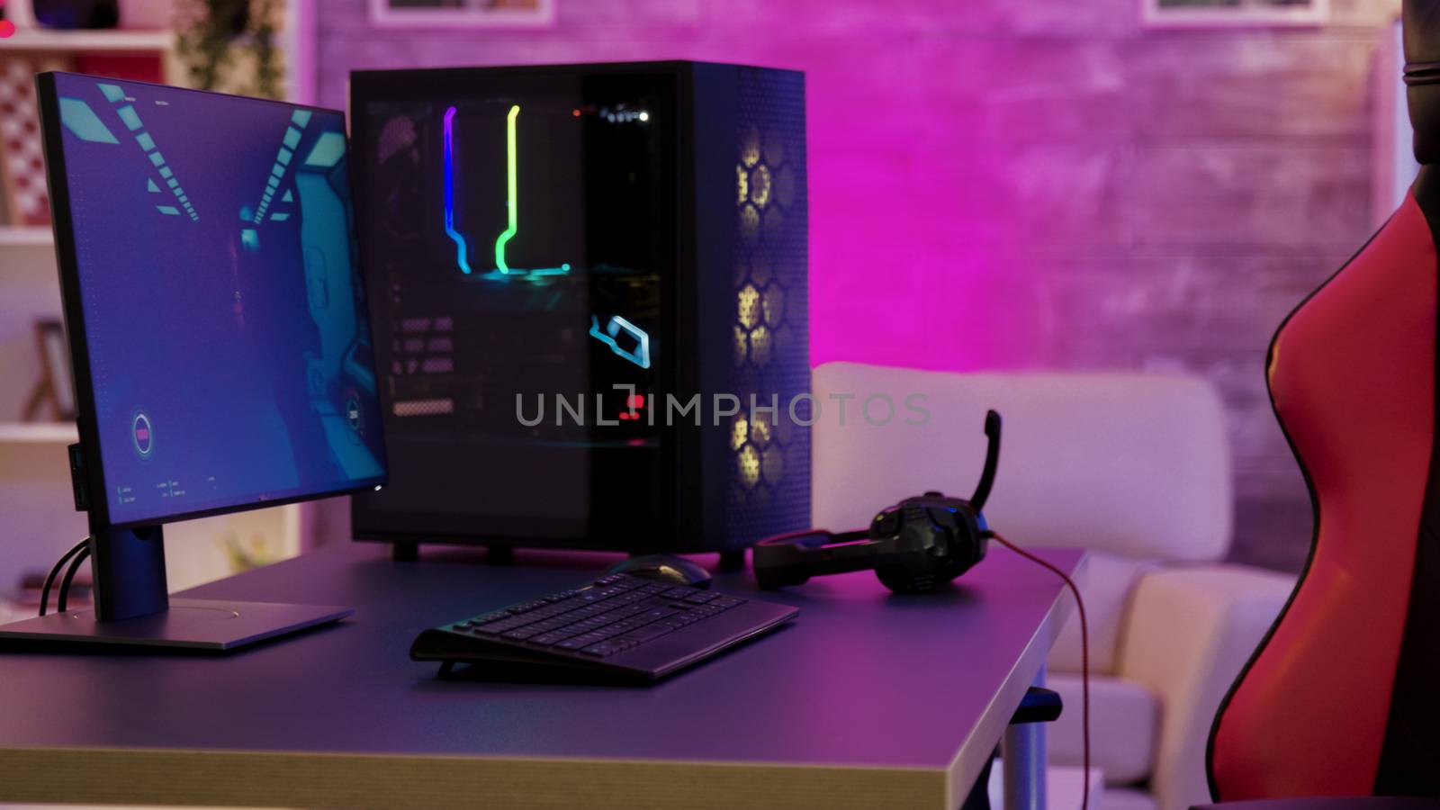 Pc unit un colorful neon lighst for online gaming. Gaming chair