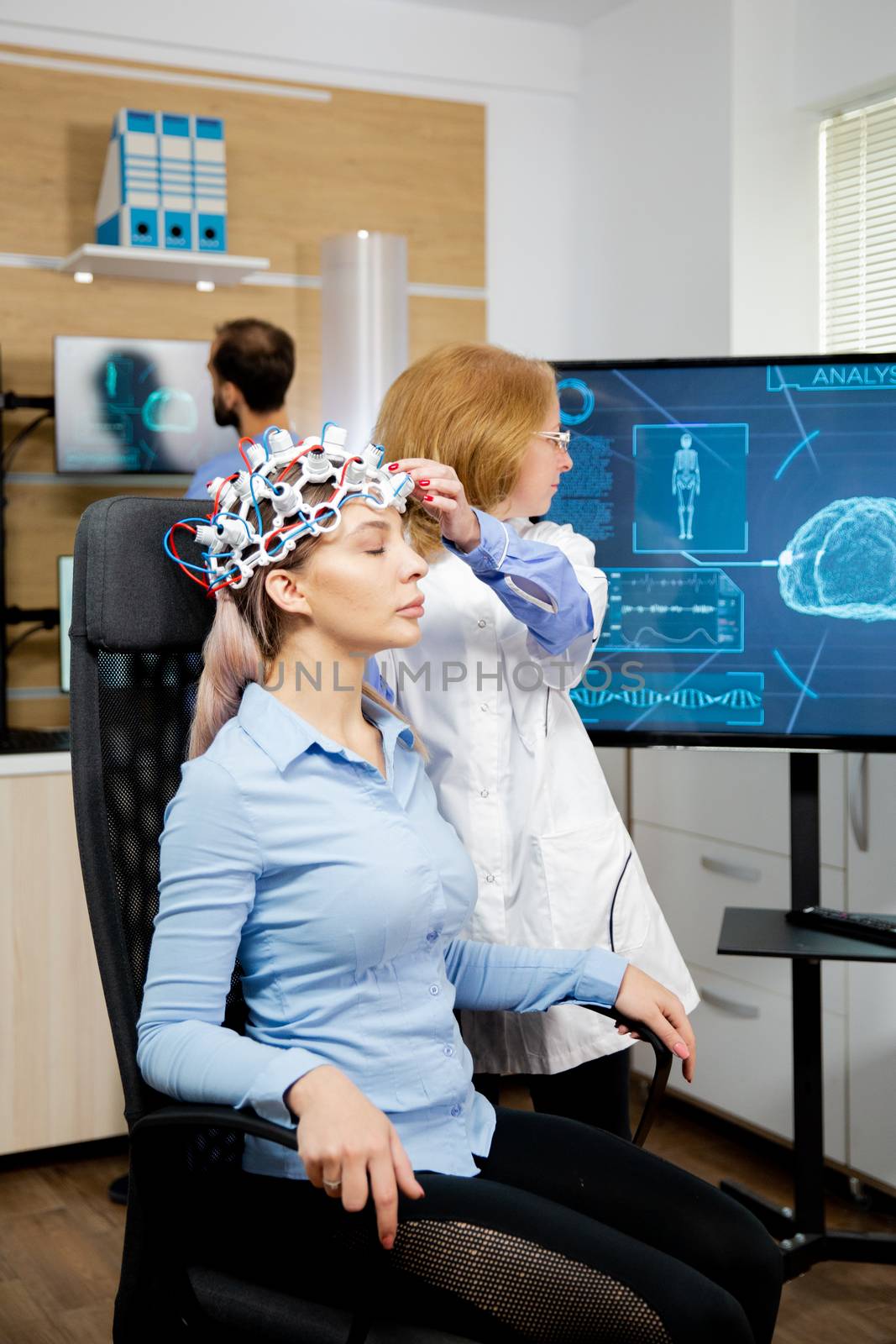 Doctor preparing brain waves scanning headset for tests. Doctor scanning brain activity