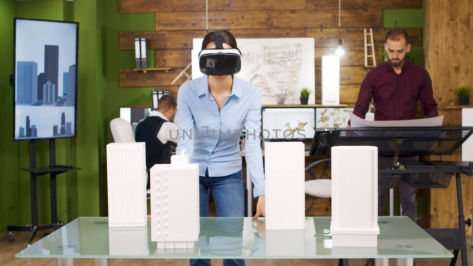 Female architects exploring virtual reality projects of business buildings. Future of architecture and building industry.