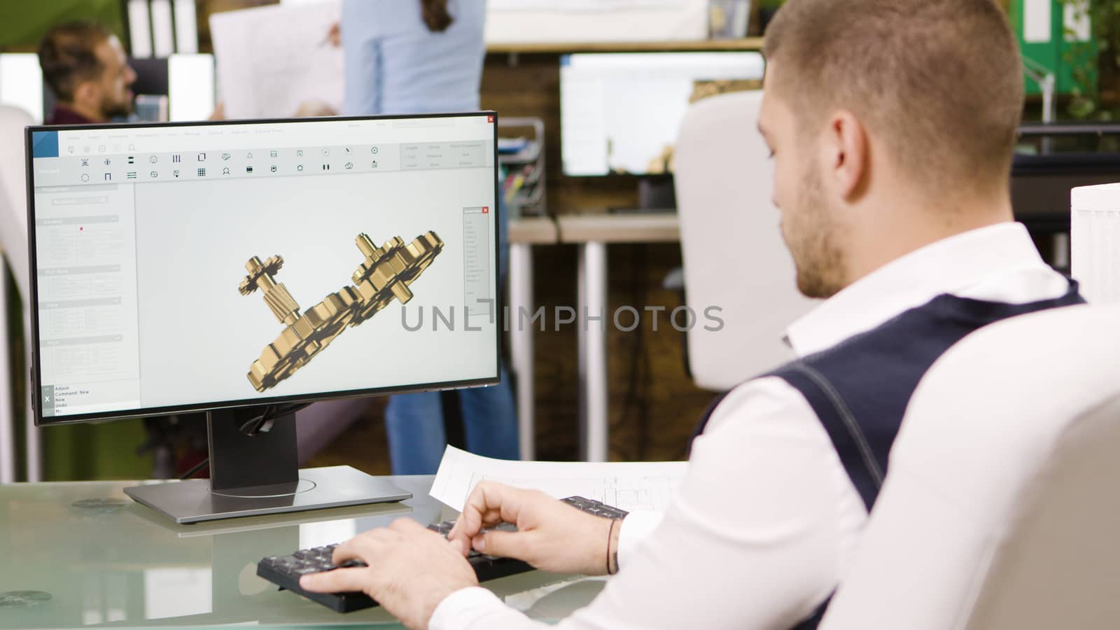 Bearded construction engineer working on his computer. Young entrepreneur.