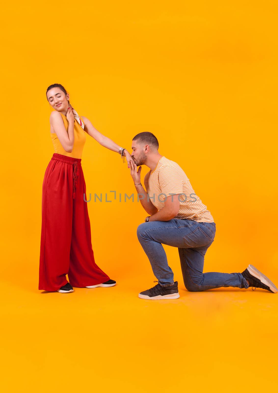 Boyfriend kissing his future wife hand after marriage proposal. Beautiful girlfriend.