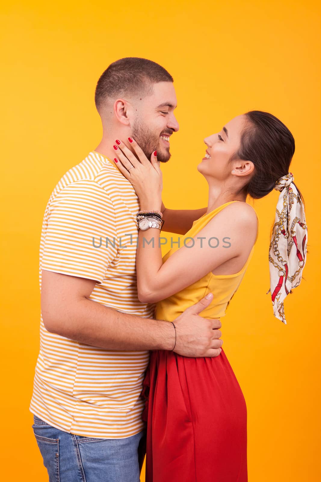 Beautiful young couple smiling and looking at each other. Romantic couple.