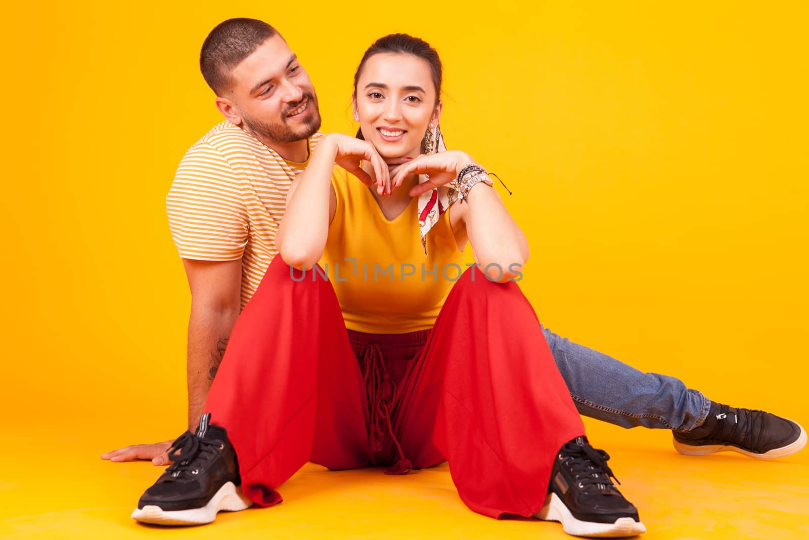 Beautiful girlfriend having a big smile while boyfriend looking at it. Attractive girlfriend.