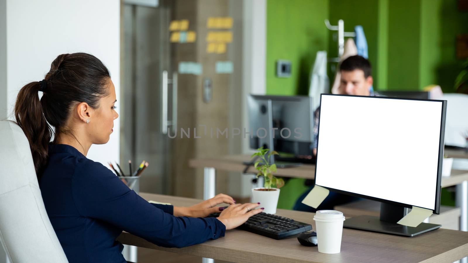 Yang manager work in modern office. Typing something