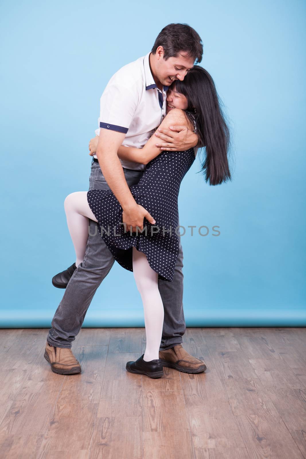 Interracial couple showing their love for each other in studio. Interracial couple. Asian girlfriend.